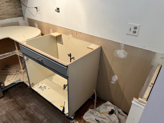 Kitchen cabinetry removed during a small kitchen remodel in Bedford