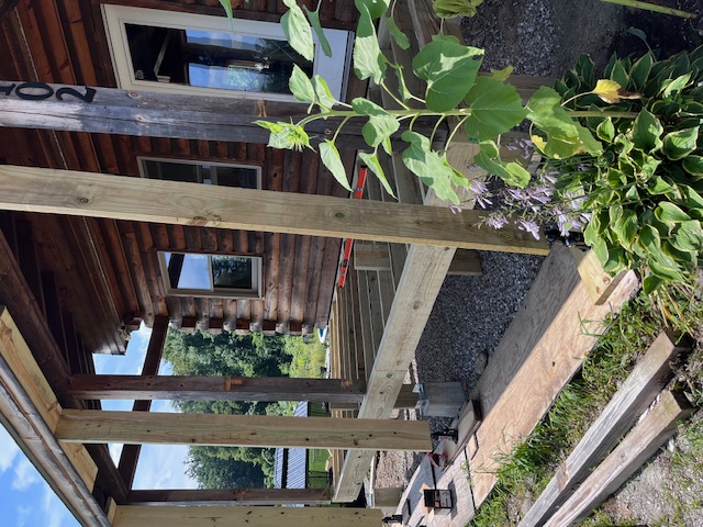 Deck framing rebuild in progress at a Goffstown log home