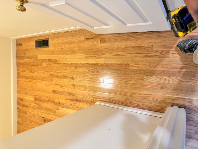 Hallway with newly installed hardwood flooring in Merrimack