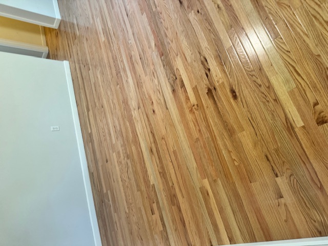 Room view of newly installed hardwood flooring in Merrimack